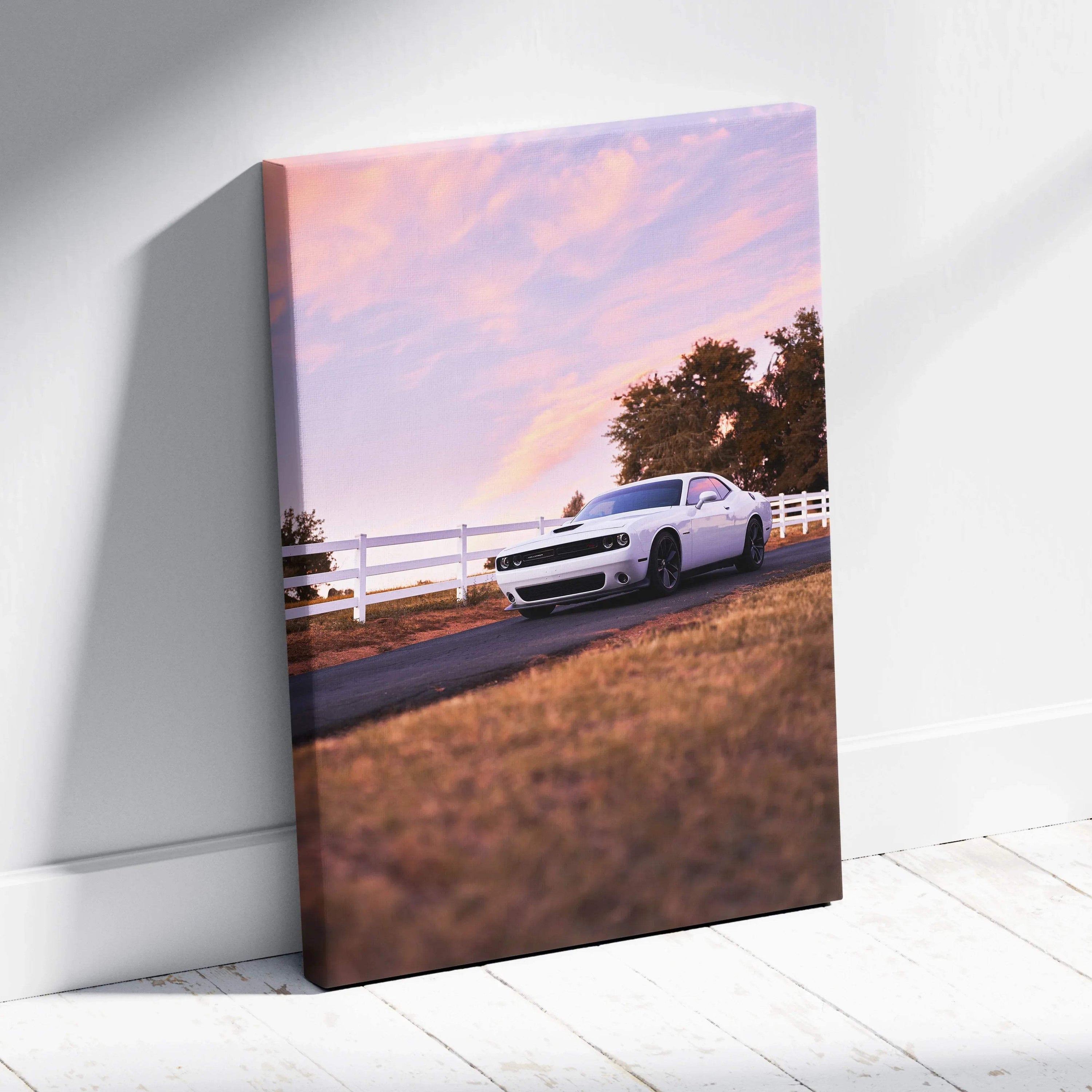 Dodge Challenger car canvas wall art with sunset sky and rural fence background.