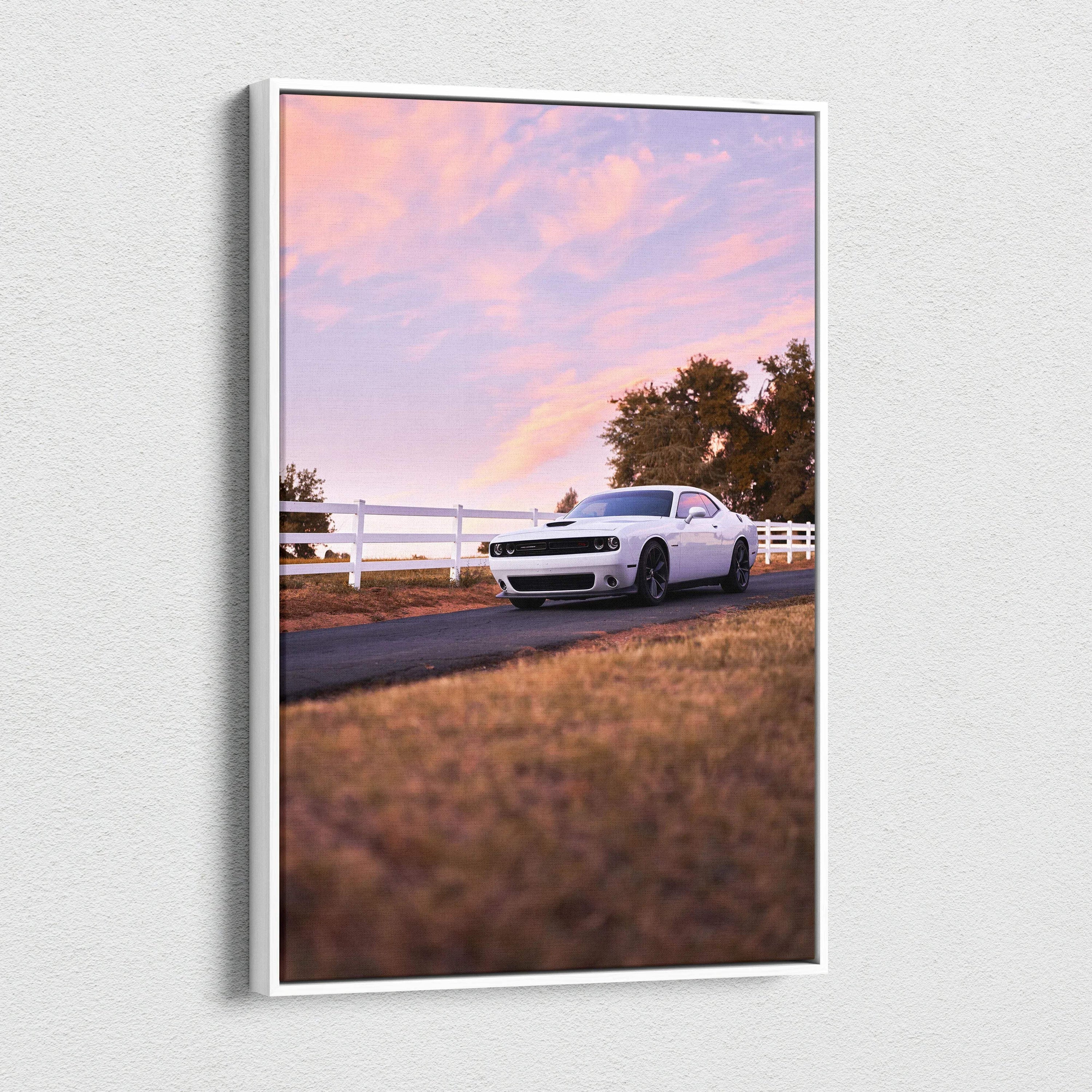 Dodge Challenger parked on road at sunset with pink sky canvas wall art vertical print.