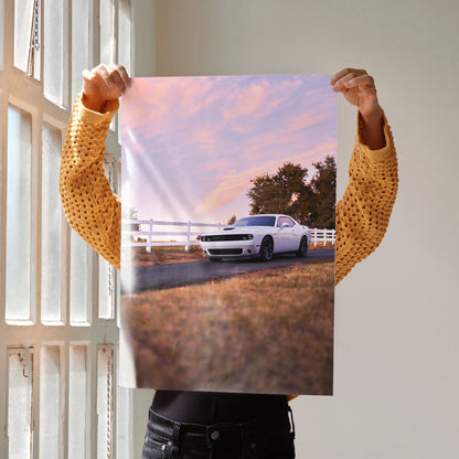 Dodge Challenger parked by white fence at sunset poster wall art.