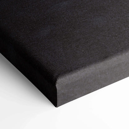 Black textured canvas corner showing wrapped edges for vertical wall art canvas print.