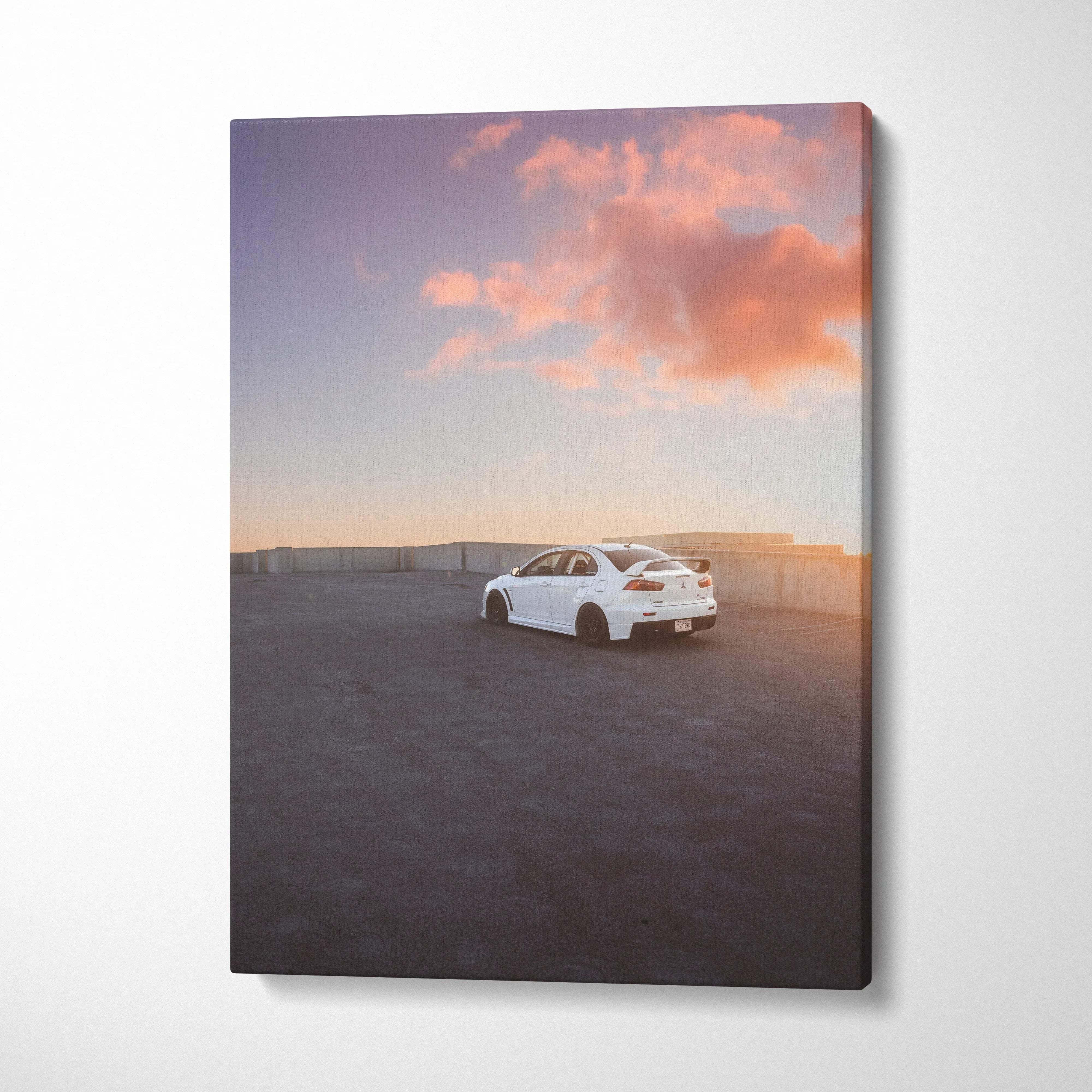 White Mitsubishi Evo 10 car at sunset with pink clouds on vertical canvas wall art.