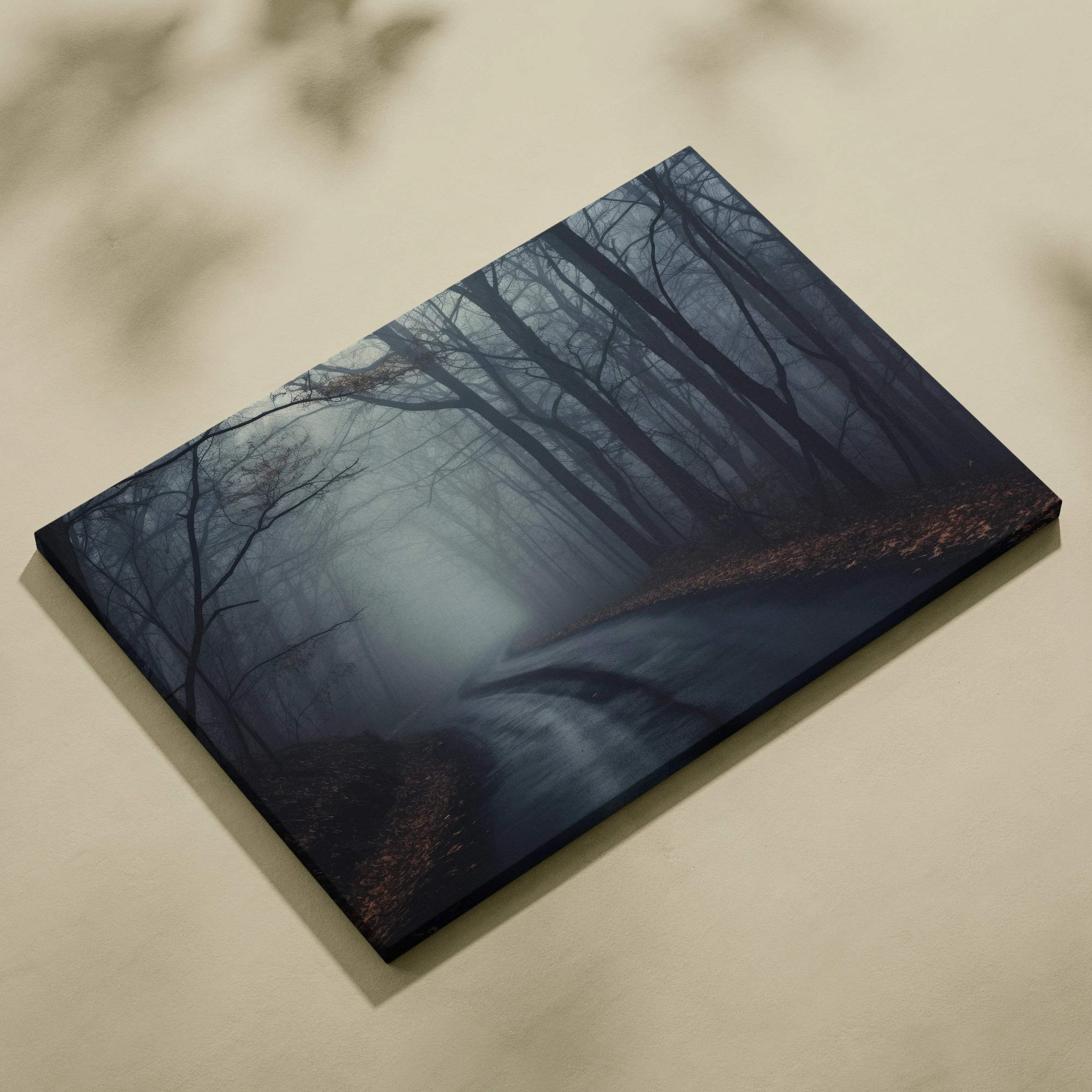 Dark foggy forest canvas wall art featuring layered trees and dense mist with muted blue-gray tones.
