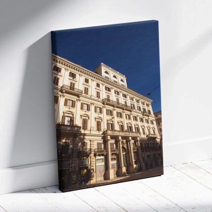 Canvas wall art featuring detailed urban architecture against a deep blue sky.