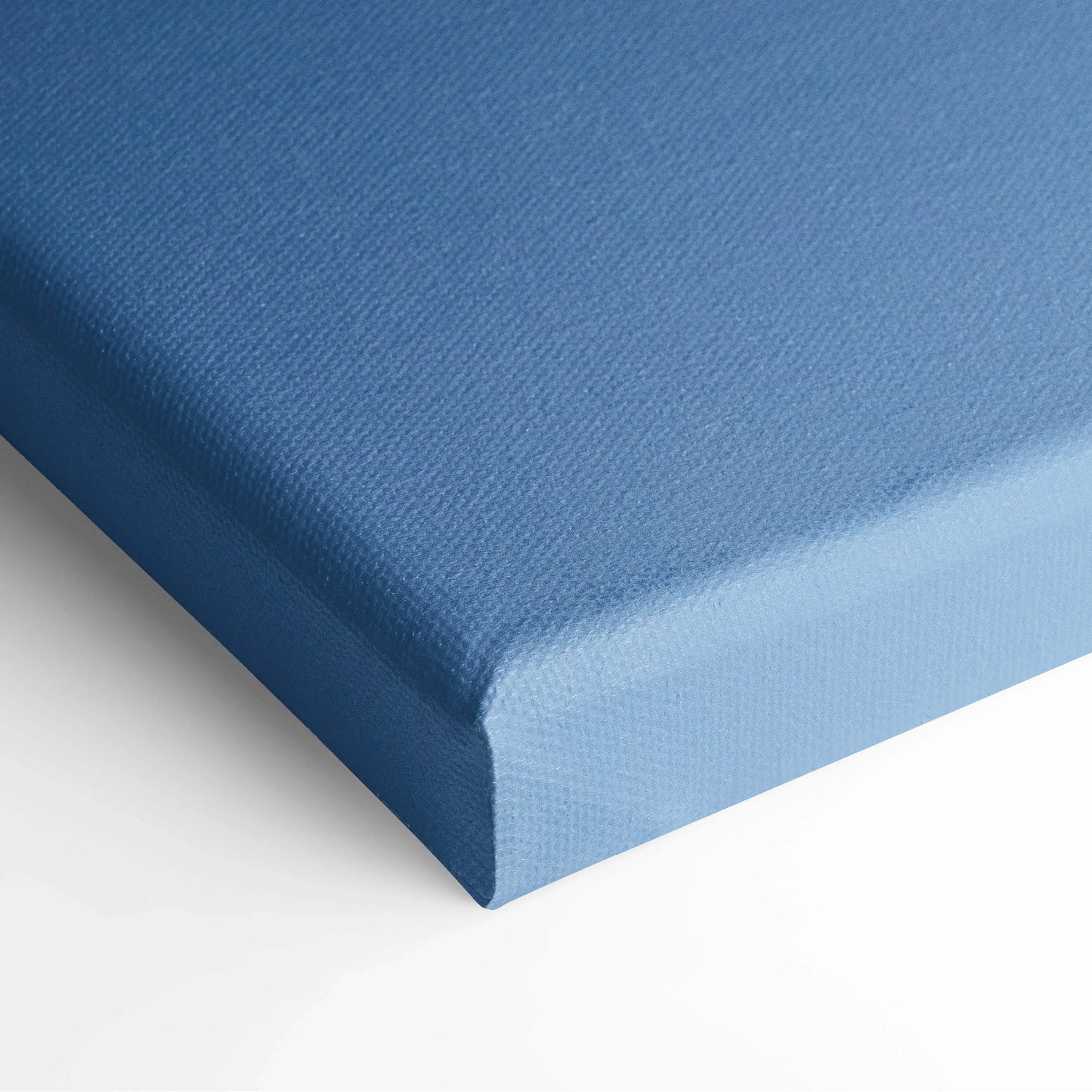 Blue canvas wall art with a smooth texture and neatly wrapped corners.