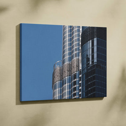 Abstract modern building reflections on sleek glass facade canvas wall art.