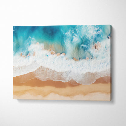 Canvas wall art featuring a tranquil ocean coastline with blue-green waves gently crashing onto sandy beige shore.