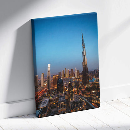 Canvas wall art print featuring a nighttime city skyline with illuminated skyscrapers, including a tall modern tower under a