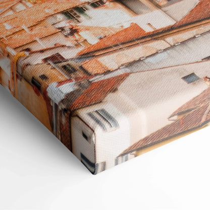 Close-up of canvas art featuring detailed urban architecture in warm earth tones, wrapped around a wooden frame.