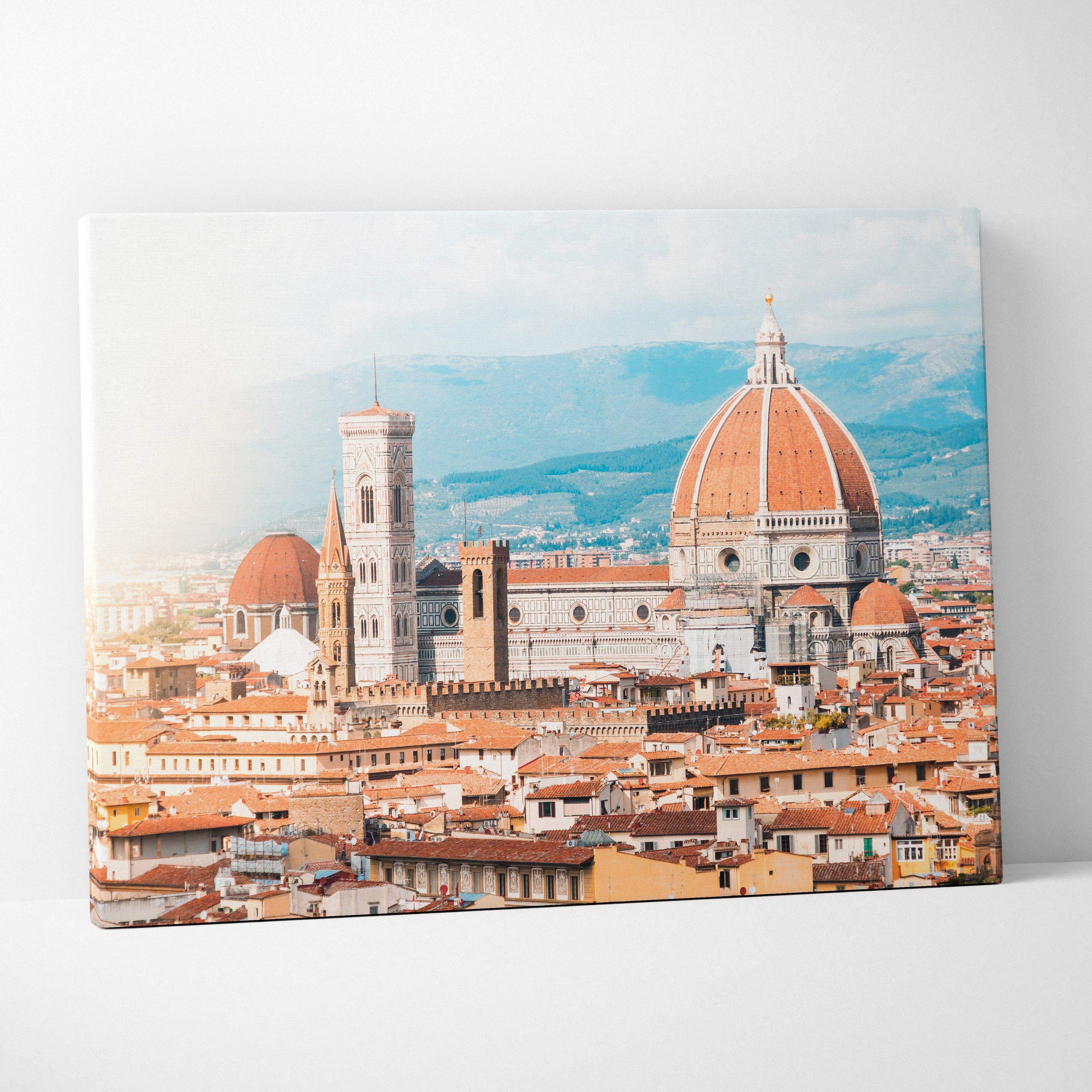 Canvas wall art featuring a detailed digital cityscape of historic buildings with terracotta roofs and a prominent domed.