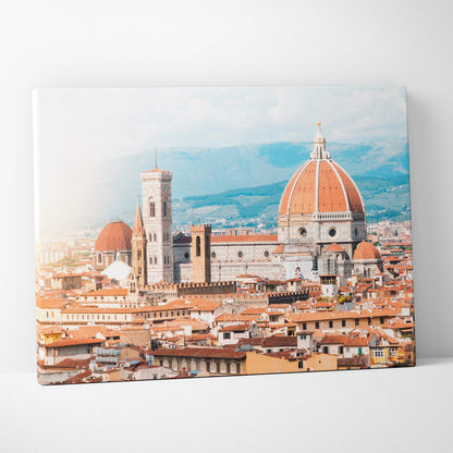Canvas wall art featuring a detailed digital cityscape of historic buildings with terracotta roofs and a prominent domed.