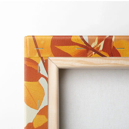 Corner detail of canvas wall art with orange and yellow autumn leaves on wooden frame.