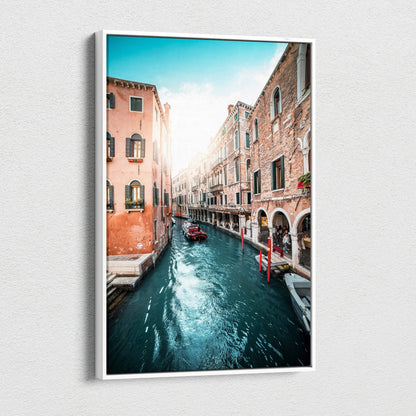 Vertical canvas wall art featuring a sunlit canal flanked by historic brick buildings with arched windows and balconies.