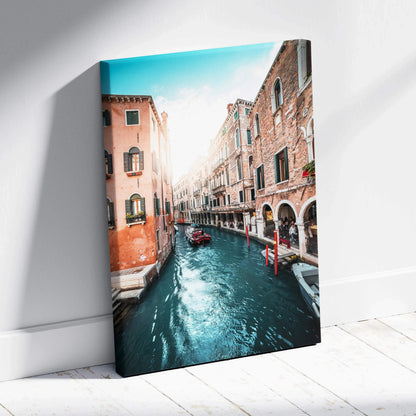 Venetian canal scene canvas wall art with sunlit historic buildings and gondola on water.