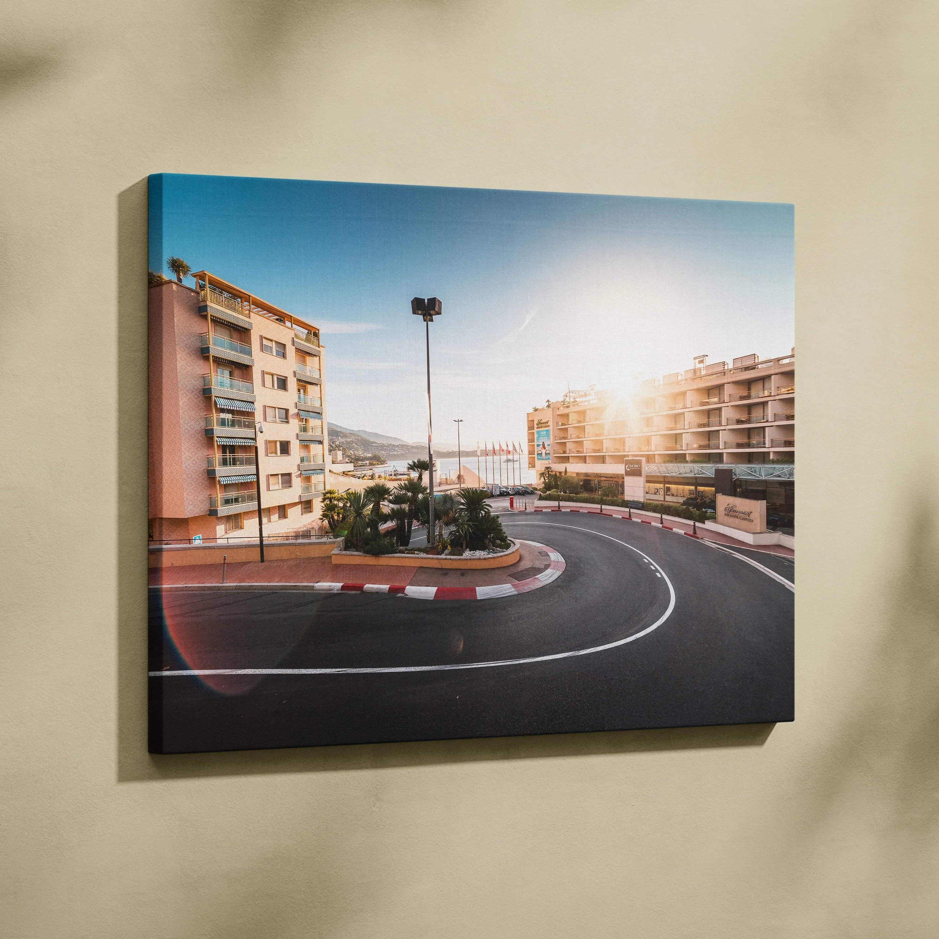 Monaco F1 track hairpin curve on canvas wall art with urban buildings and sunset light.