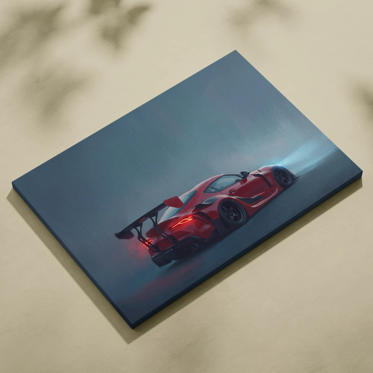 Red sports car canvas print featuring a sleek aerodynamic design with red taillights and rear spoiler for office decor