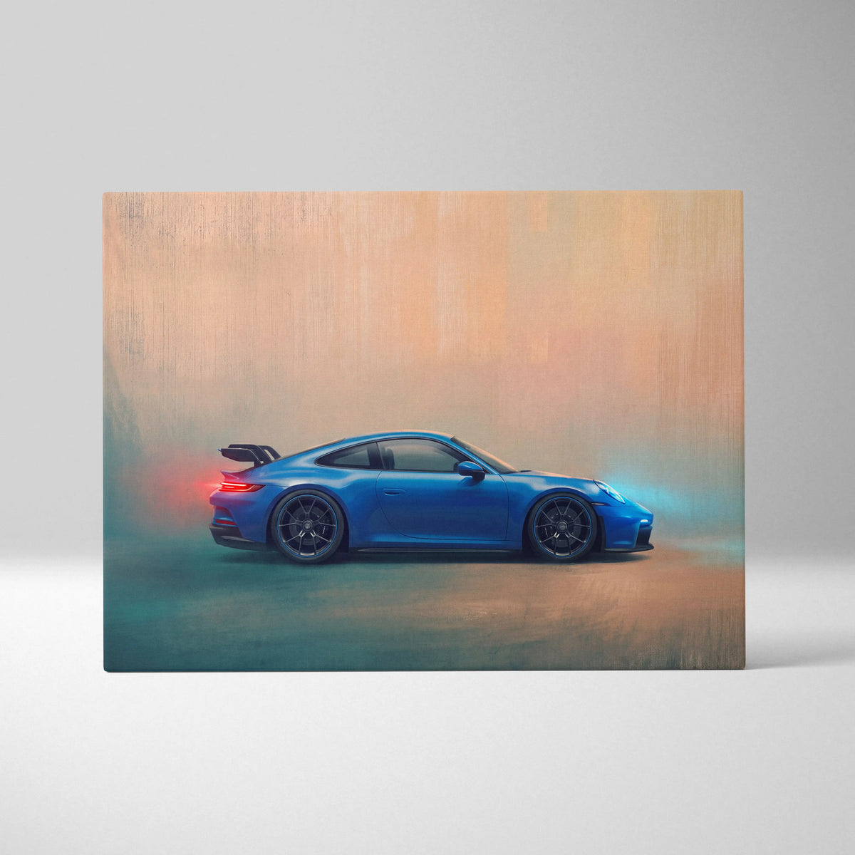 Porsche 911 GT3 inspired canvas art featuring a vibrant blue car with black alloy wheels and rear spoiler