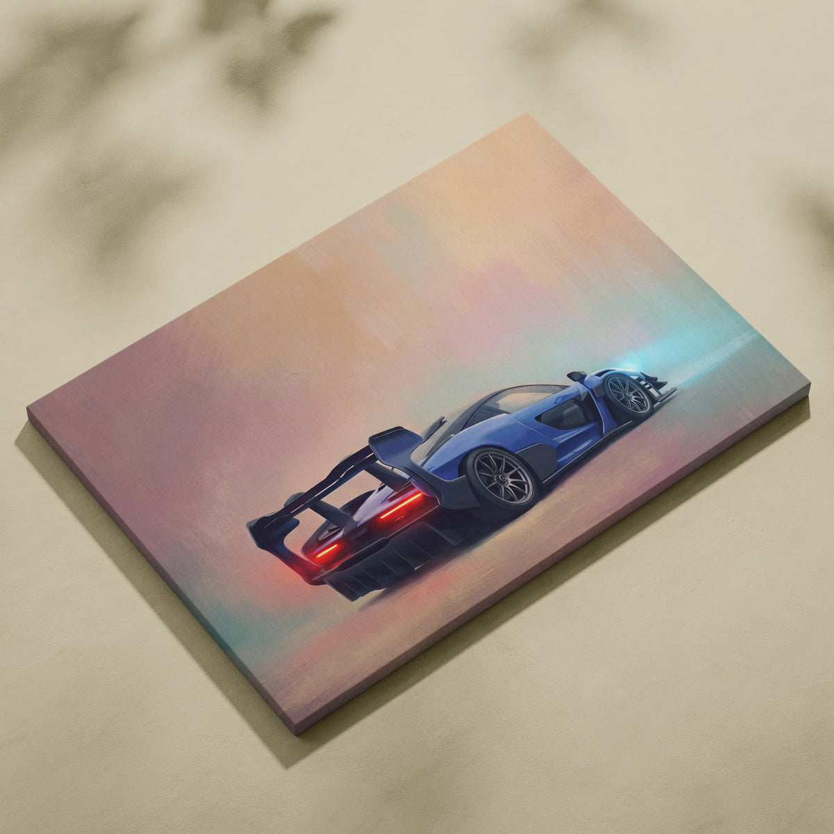 Blue sports car canvas print showing back with glowing red taillights and rear spoiler inspired by McLaren Senna
