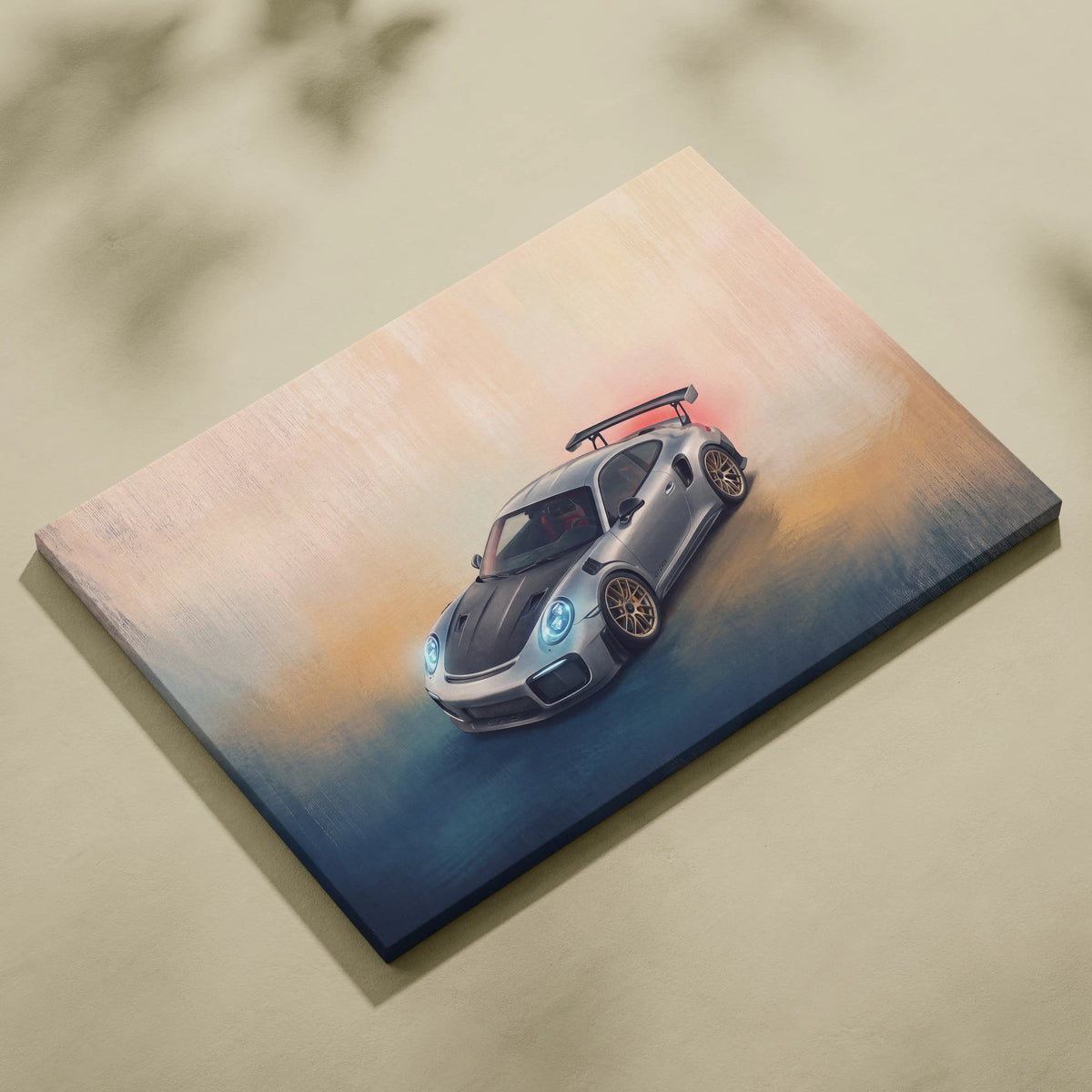 Silver Porsche 911 GT3 RS canvas print with glowing blue headlights and gold rims premium automotive wall decor