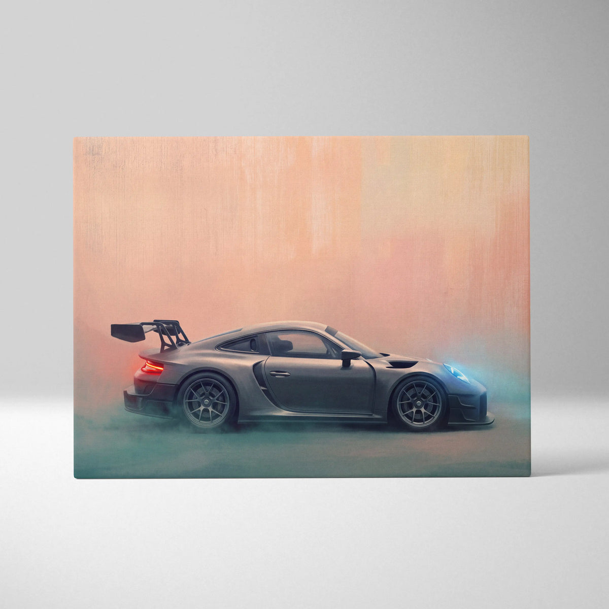 A sleek matte gray porsche 911 gt2 race car canvas print with glowing red and blue accents on a peach to teal background