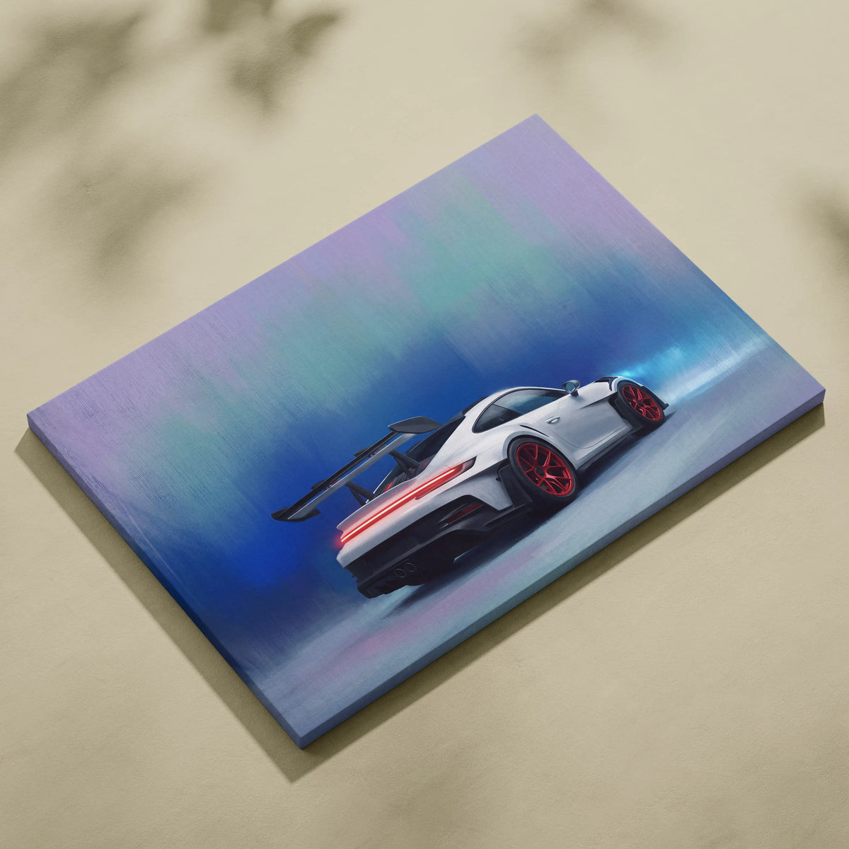 Porsche 911 GT3 RS inspired automotive wall art featuring white sports car with red rims and black spoiler on canvas