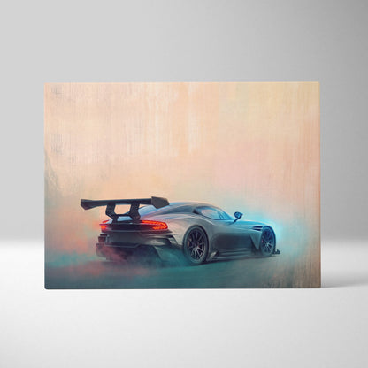 A dark gray aston martin vulcan inspired sports car with rear spoiler in motion on luxury supercar canvas print