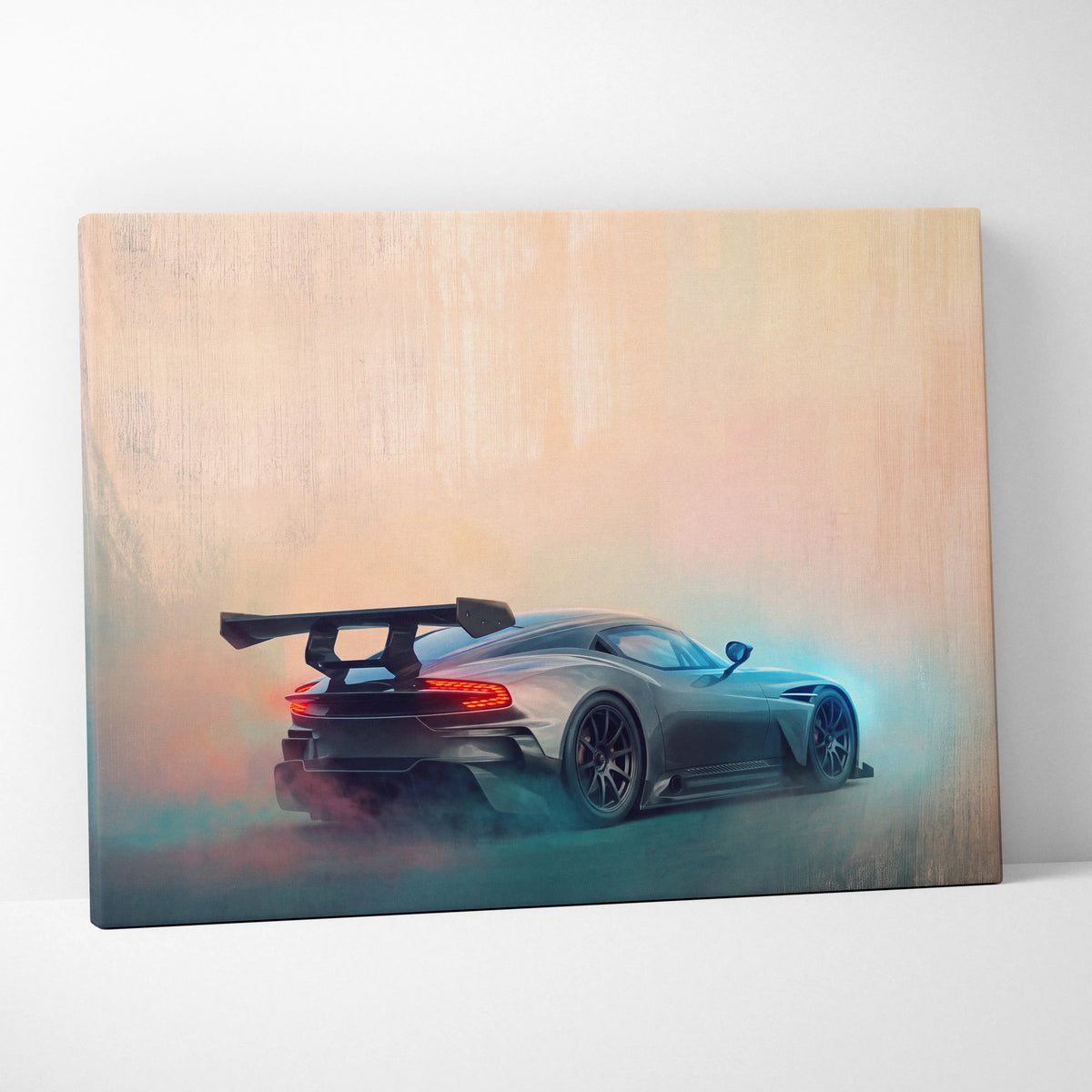 A matte black Aston Martin Vulcan inspired sports car with rear spoiler and glowing taillights on luxury canvas print