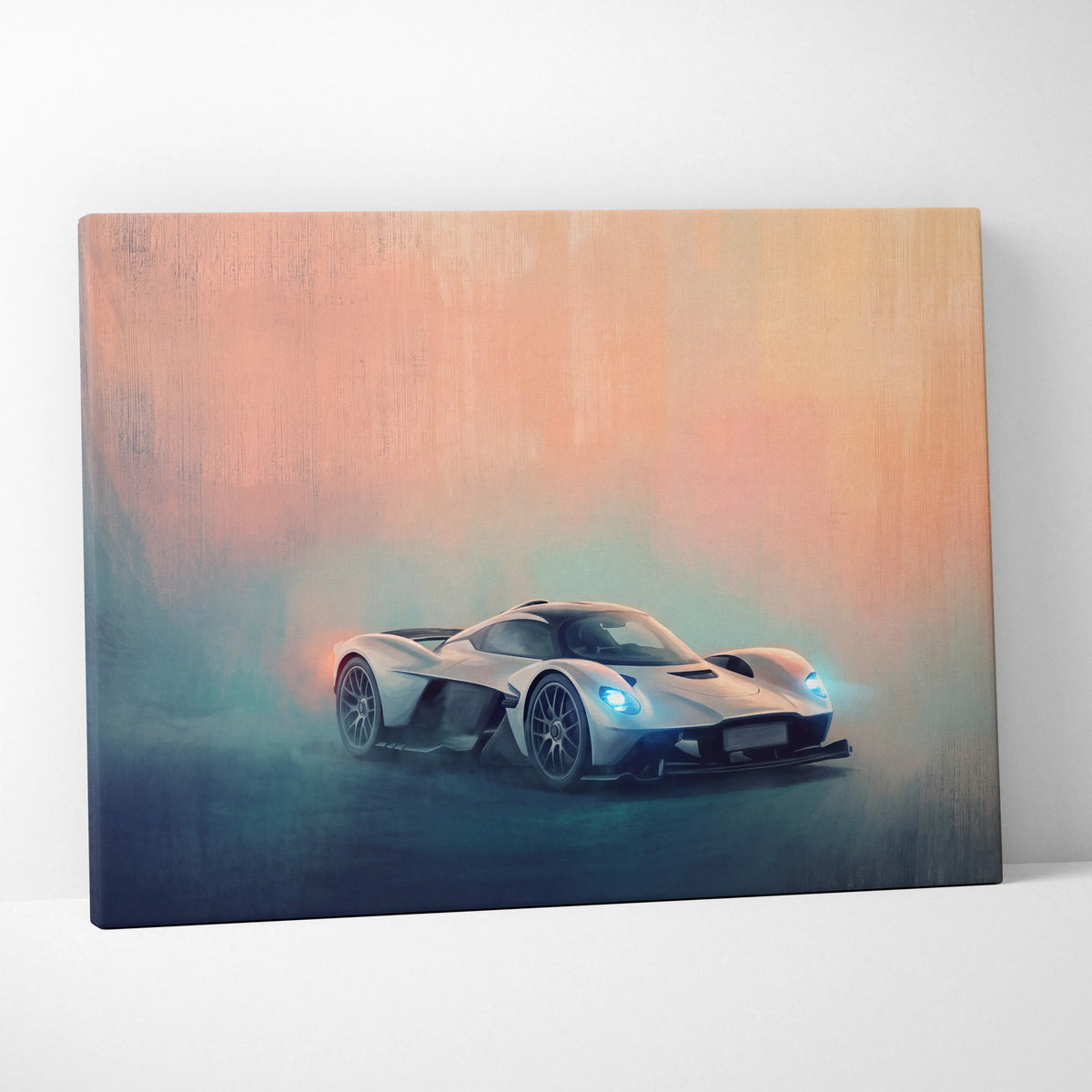 Aston Martin Valkyrie AMR Pro inspired canvas wall art featuring a sleek silver sports car with glowing blue headlights