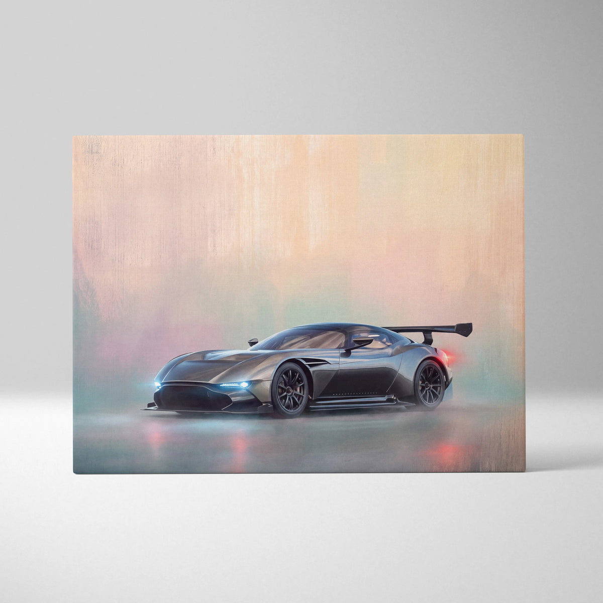 Aston Martin Valkyrie inspired supercar canvas art featuring a matte black race car with rear wing and blue headlights