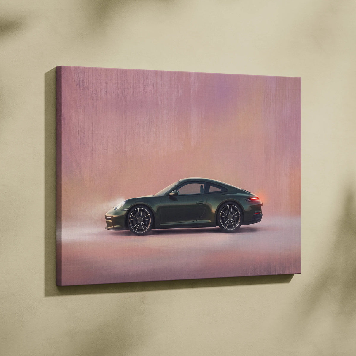 A sleek dark green porsche 911 canvas art print with side profile on soft pink and orange gradient backdrop