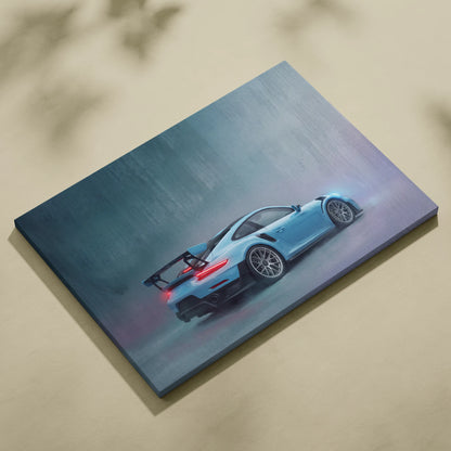 A canvas print of a light blue Porsche 911 GT2 RS in motion with glowing rear lights on misty background
