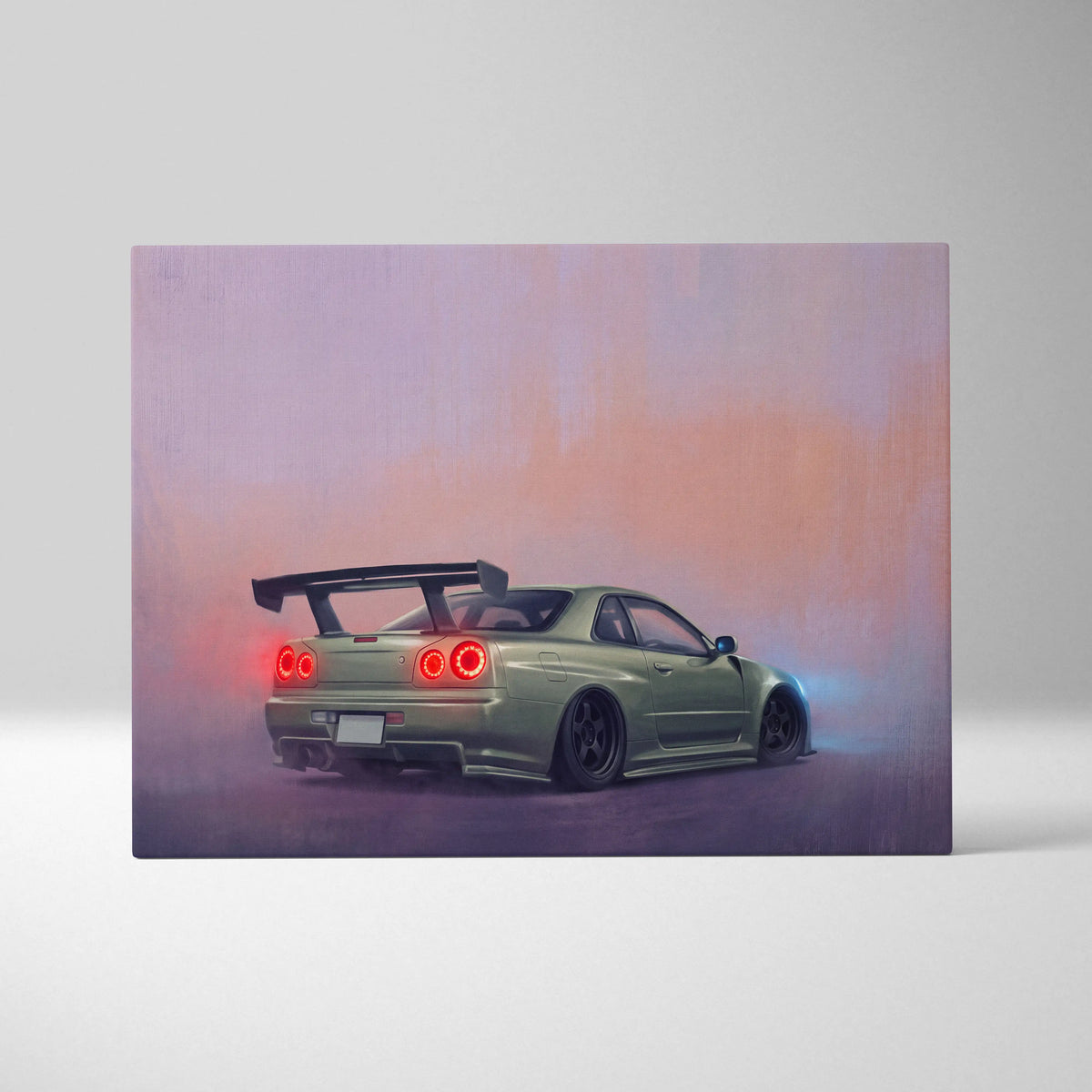 Matte olive green nissan skyline r34 gt-r sports car canvas print showing the back with glowing red taillights and black spoiler