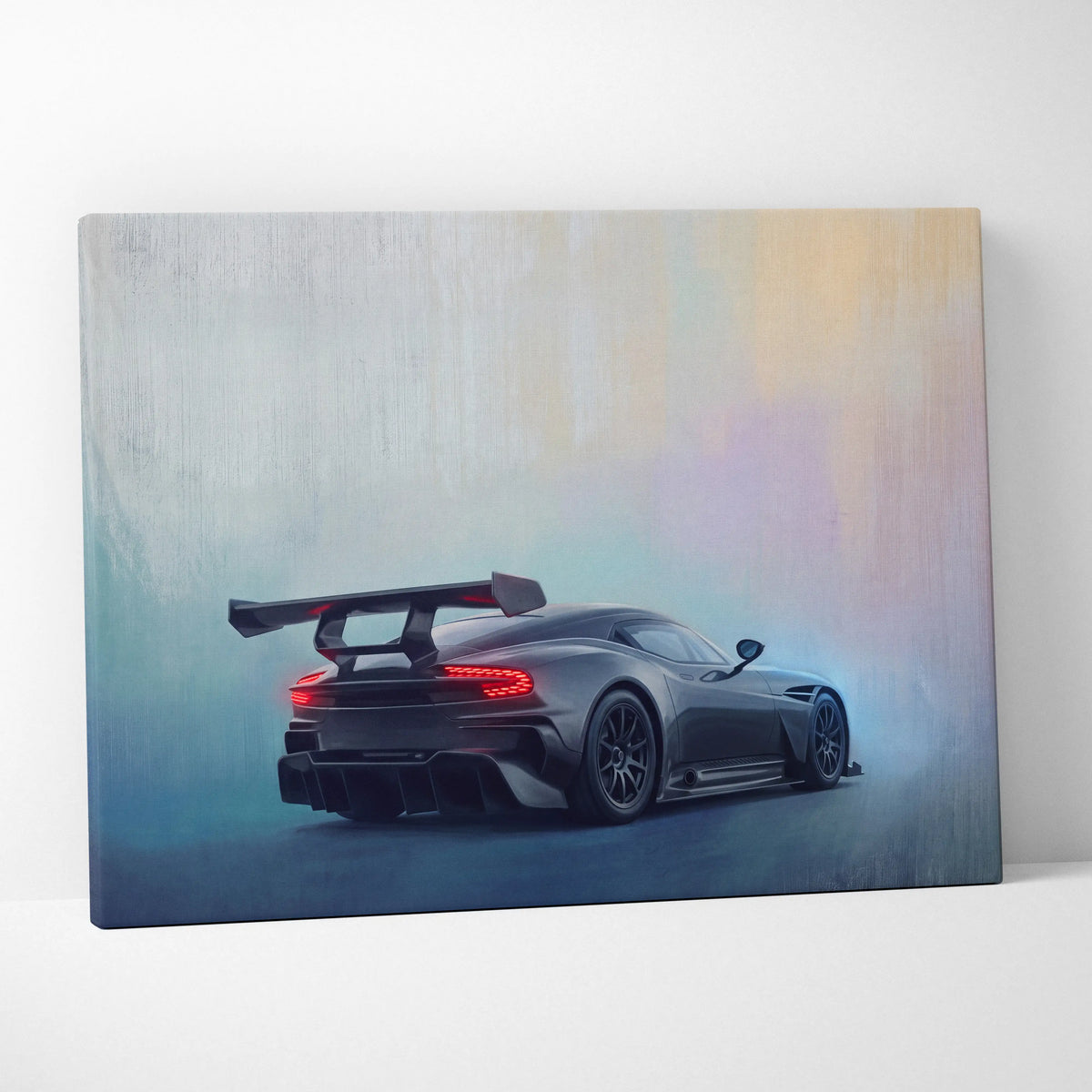 Aston Martin Vulcan inspired premium canvas art featuring a sleek matte black sports car with glowing red taillights