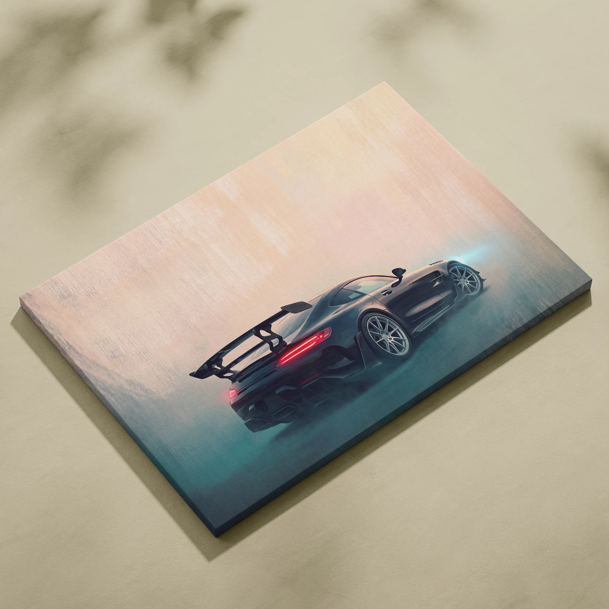 Black mercedes-amg gt r sports car canvas art featuring glowing red taillights and rear wing against peach teal sky