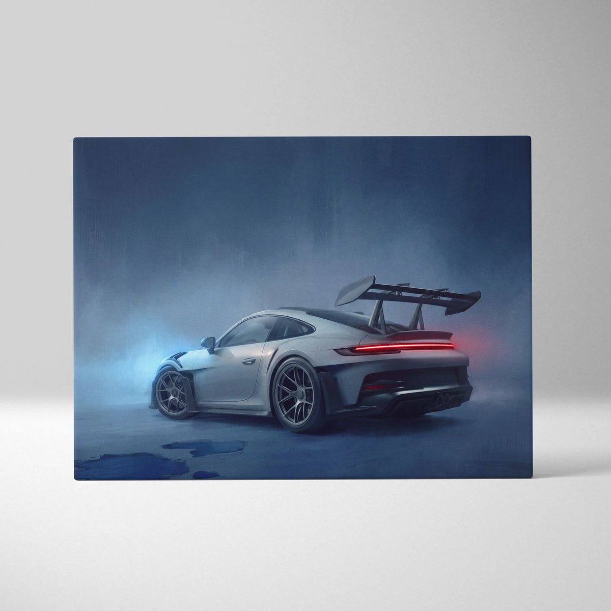 Silver porsche 911 gt3 rs canvas art with black racing spoiler and red taillights in misty blue setting wall decor