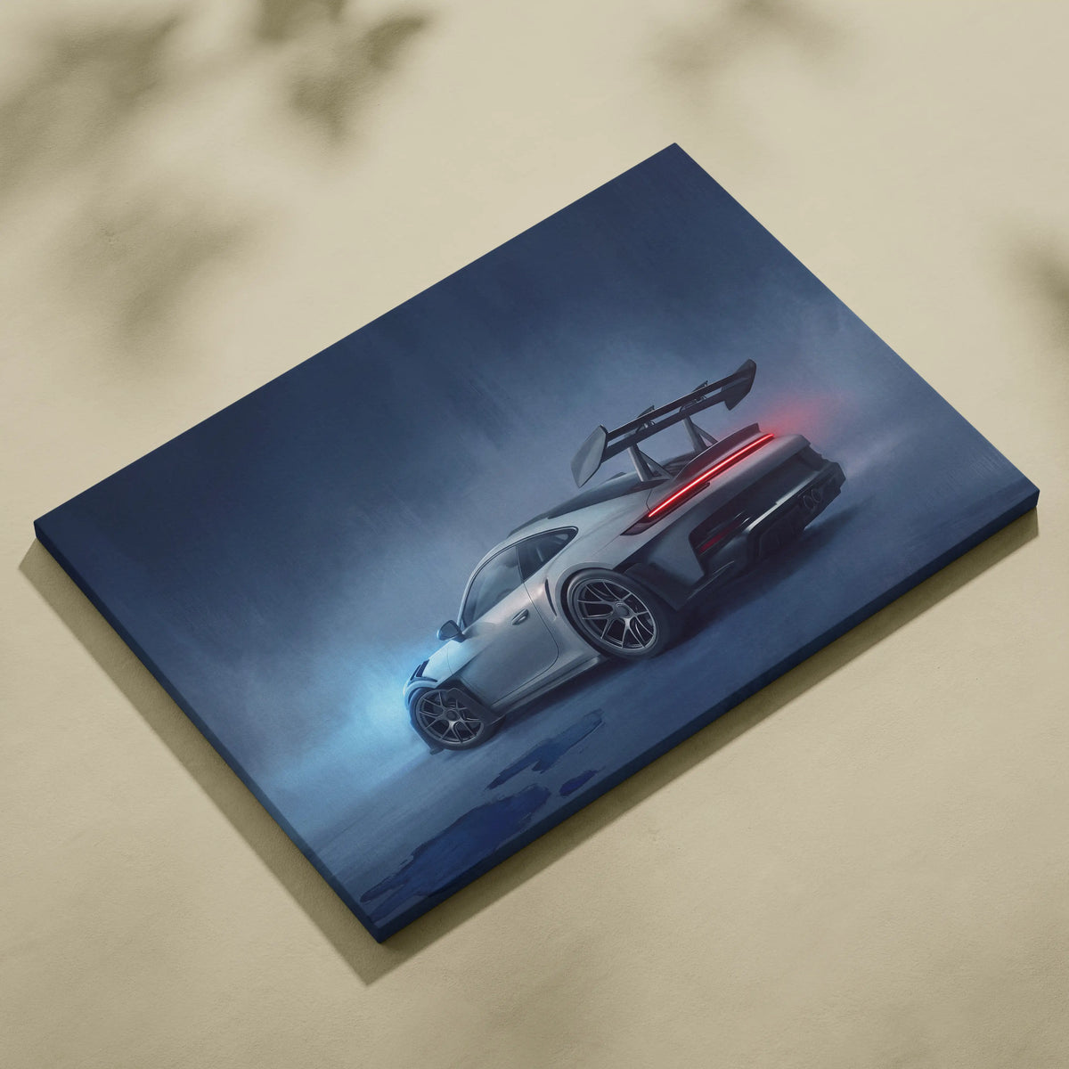 A sleek silver porsche 911 gt3 sports car with rear wing on dark blue canvas in premium automotive wall decor