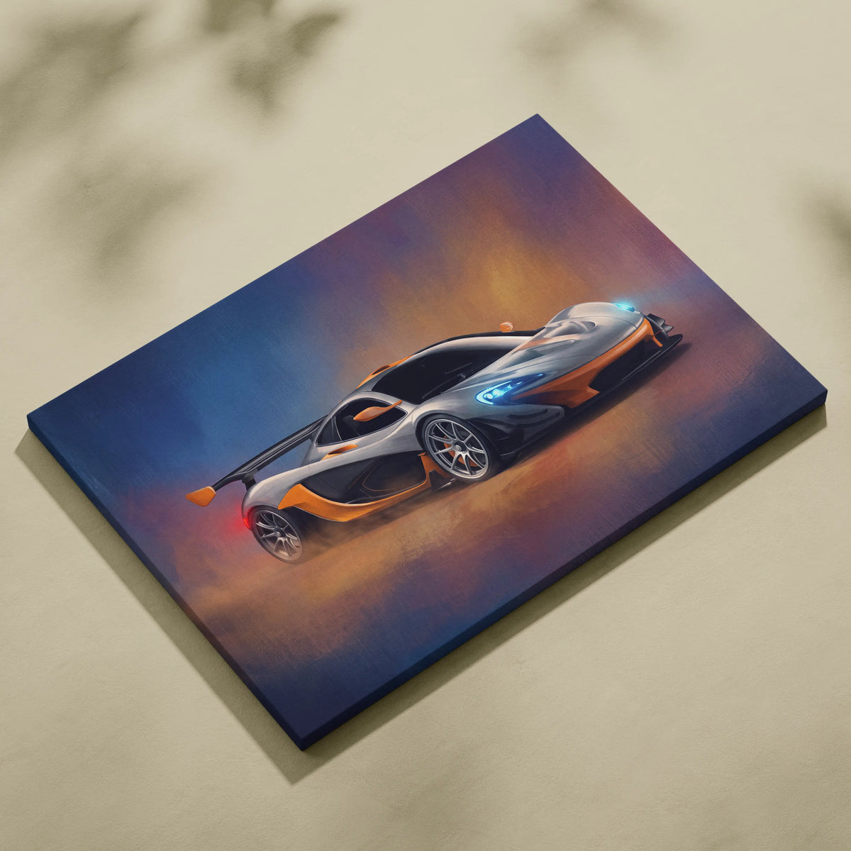 A vibrant canvas print of a silver and orange McLaren P1 sports car with glowing blue headlights on a gradient background