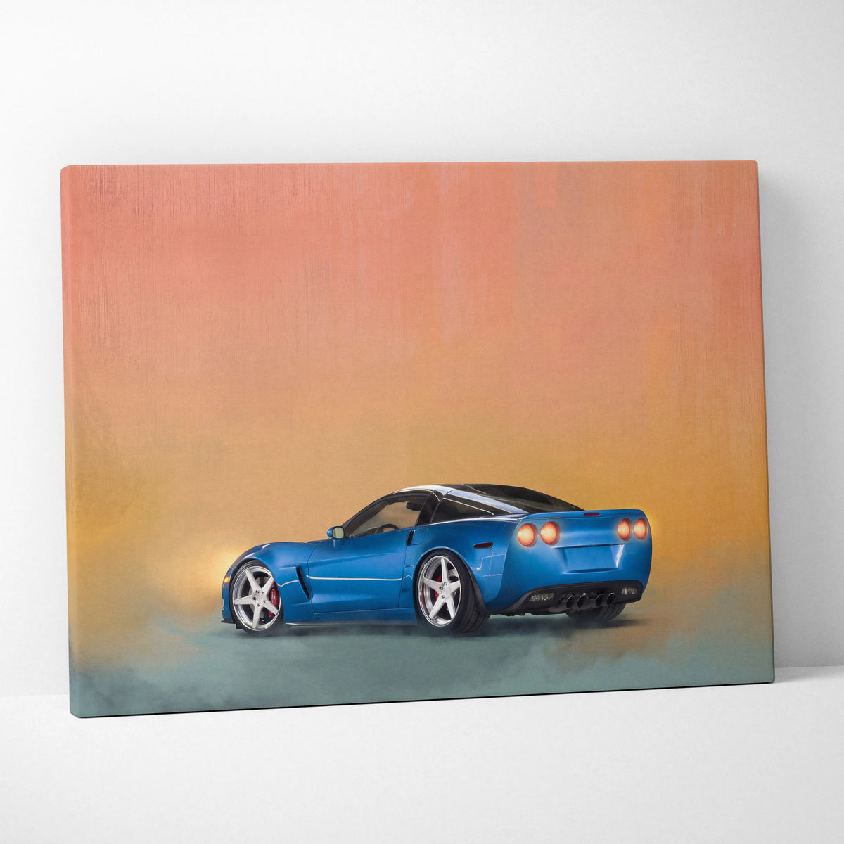 Blue Chevrolet Corvette inspired sports car canvas print with glossy finish and orange yellow gradient background for office decor