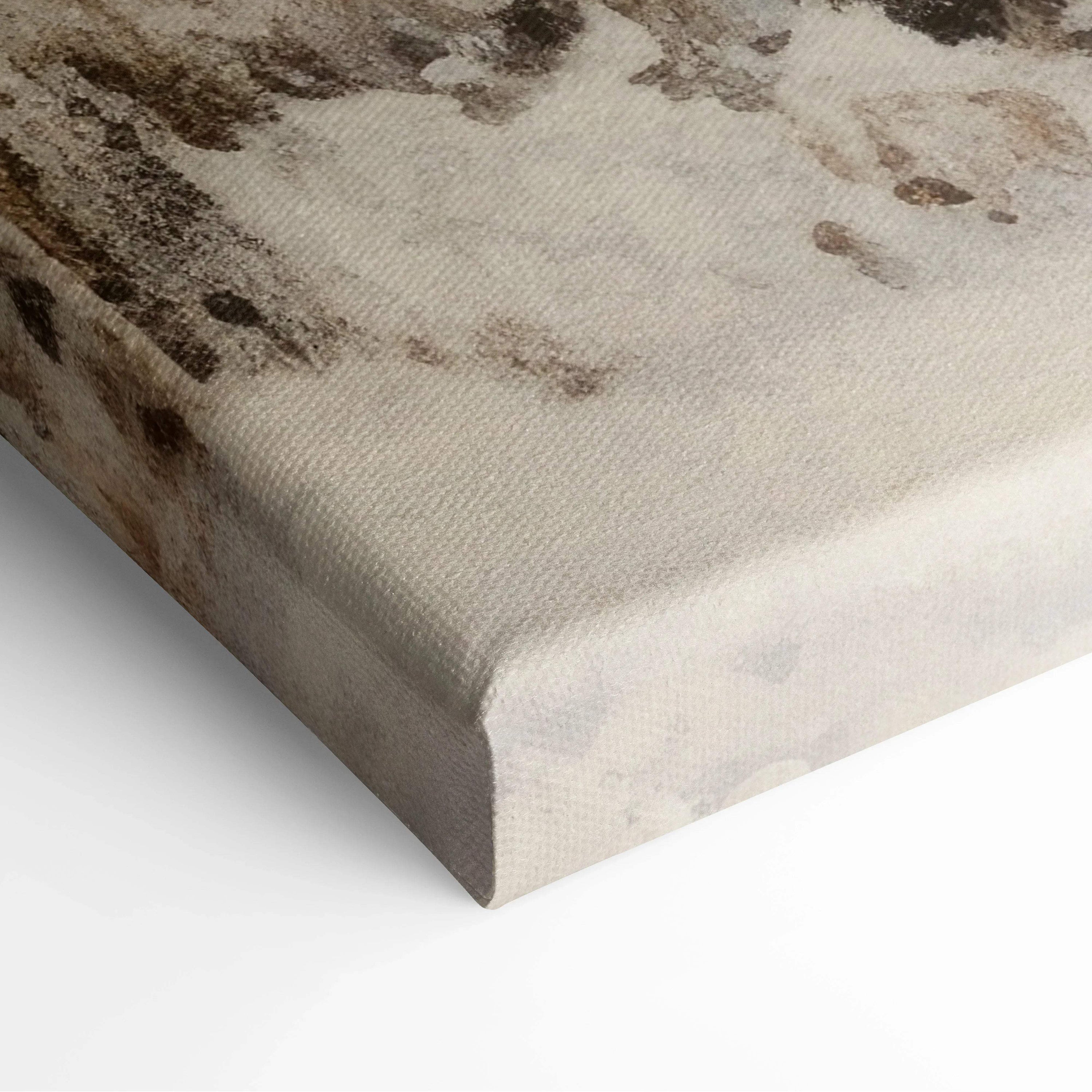 Close-up of textured canvas wall art featuring muted winter snowy landscape in soft beige and brown tones.