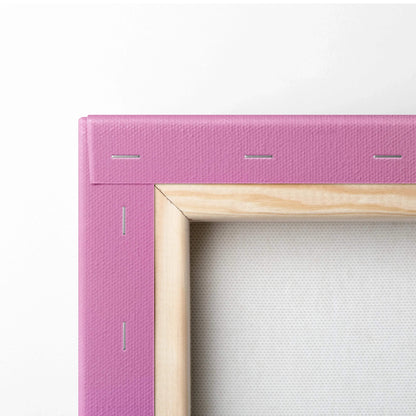 Close-up of modern abstract digital wall art canvas with pink wrapped edges and wooden frame backing.