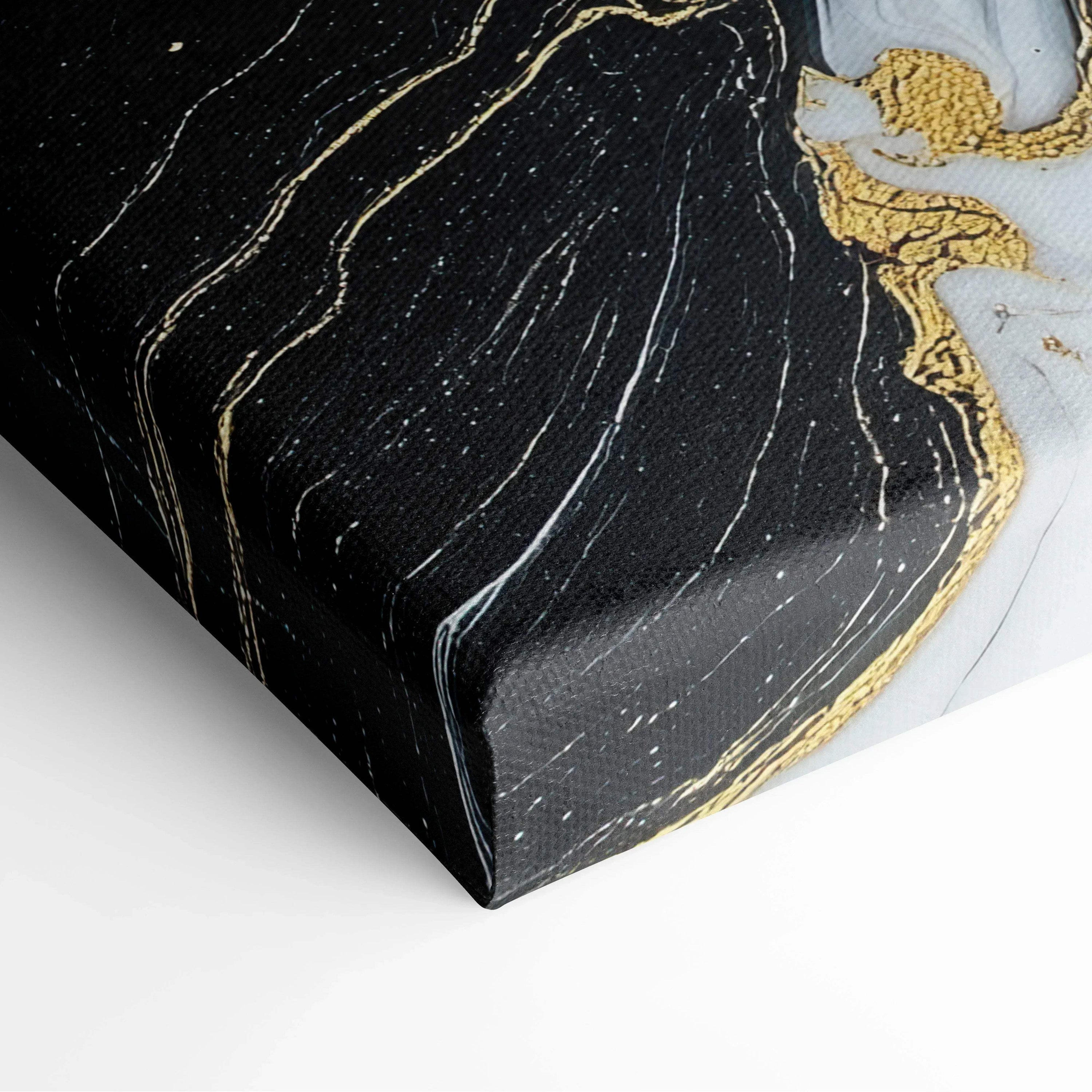 Black and white abstract canvas art with flowing gold accents and textured brushstrokes.