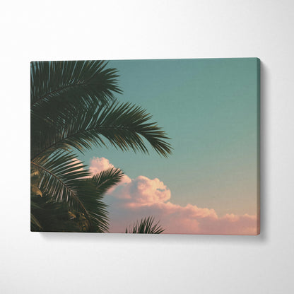 Canvas wall art featuring tropical palm trees with soft clouds against a pastel sky for decor.