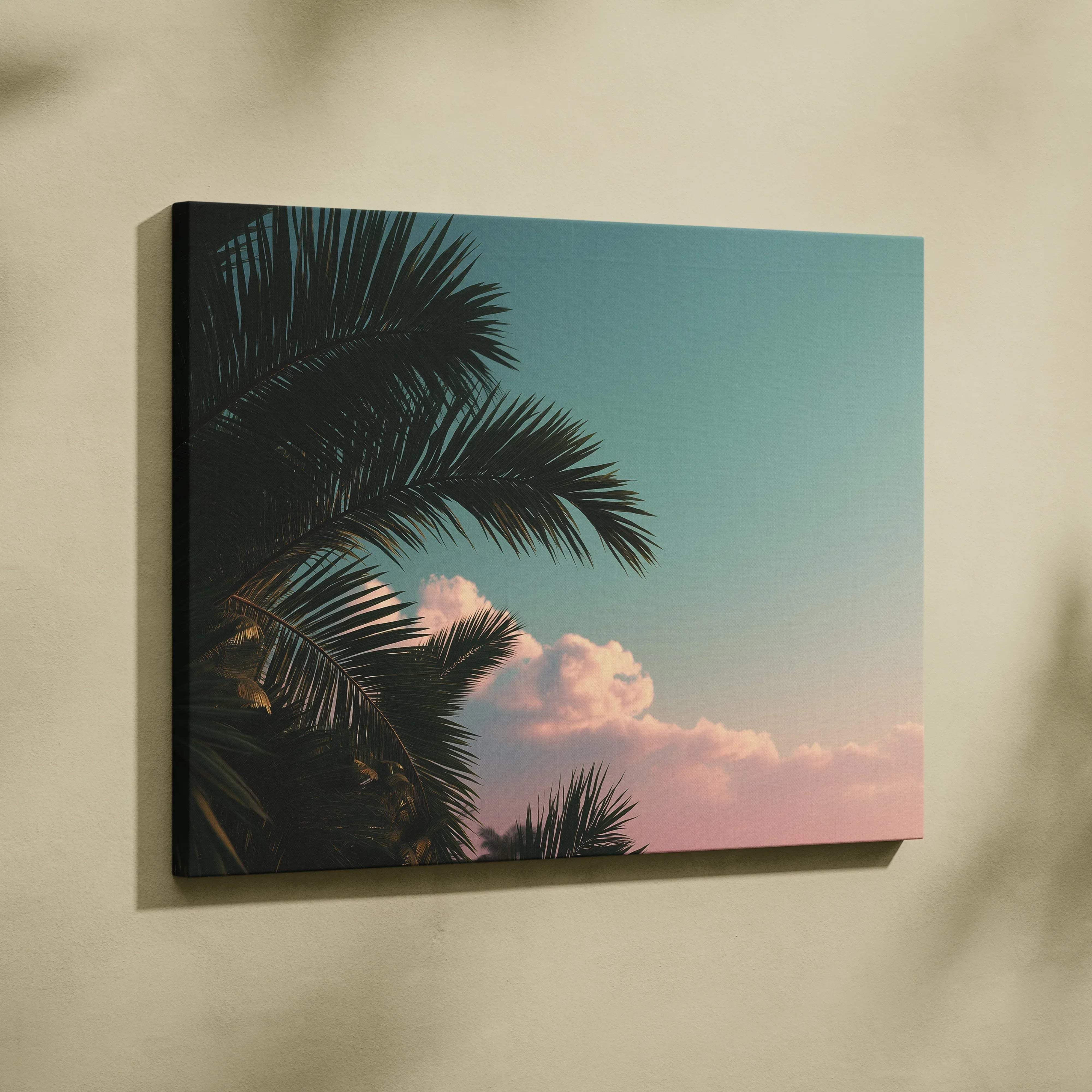 Rectangular canvas print of dark palm silhouettes against a teal to peach gradient sky with clouds for coastal decor