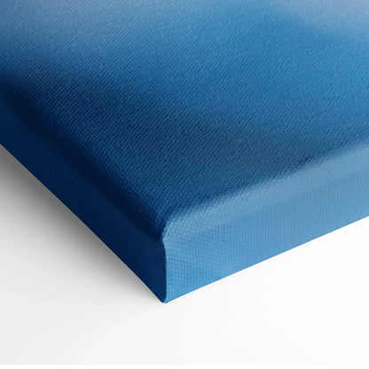 Blue textured canvas wall art close-up showing edge and fabric detail.