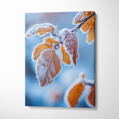 Canvas art featuring frosted orange autumn leaves against a blurred blue background, vibrant wall art.
