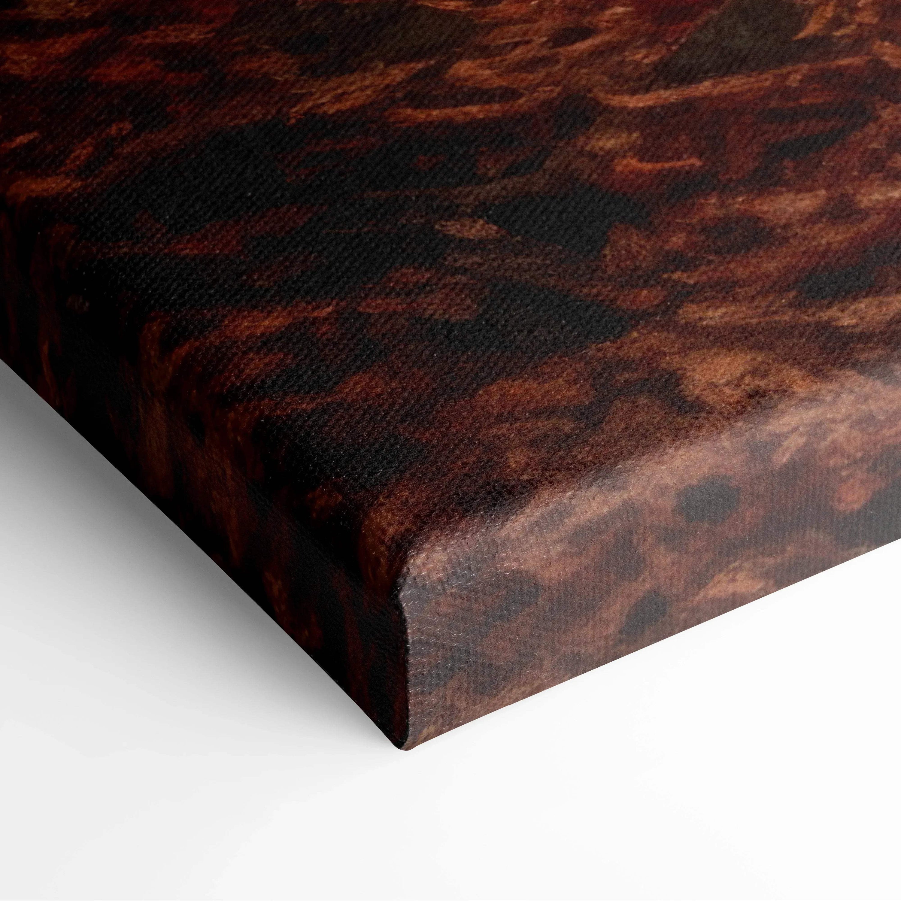 Close-up of vibrant red and orange autumn leaves on textured canvas wall art edge.