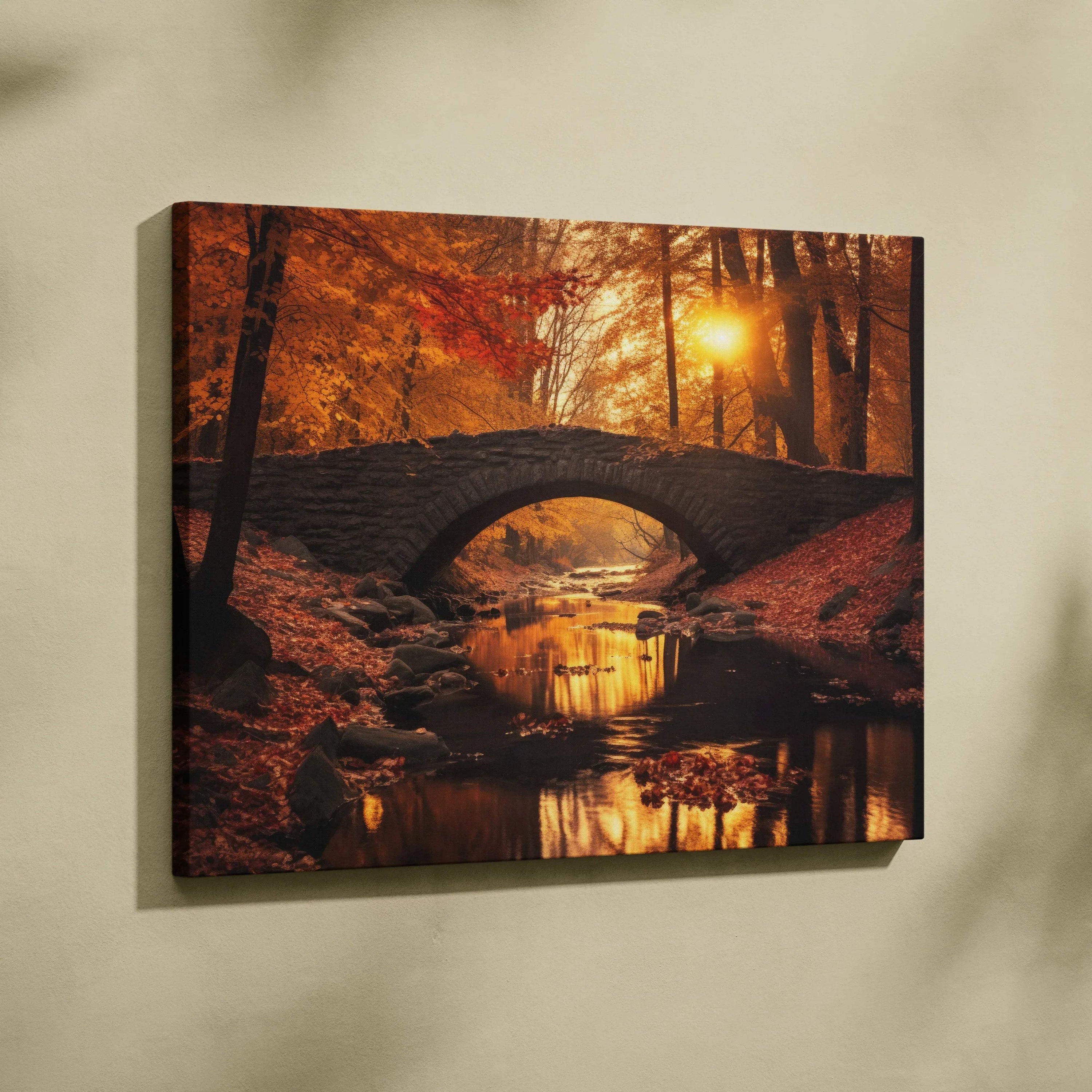 Vibrant autumn foliage canvas wall art featuring red, orange, and gold leaves with stone bridge over creek at sunset.