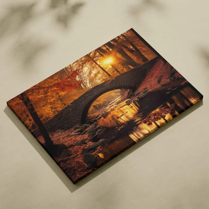 Canvas wall art depicting a stone arch bridge over a river surrounded by vibrant red, orange, and gold autumn foliage at.