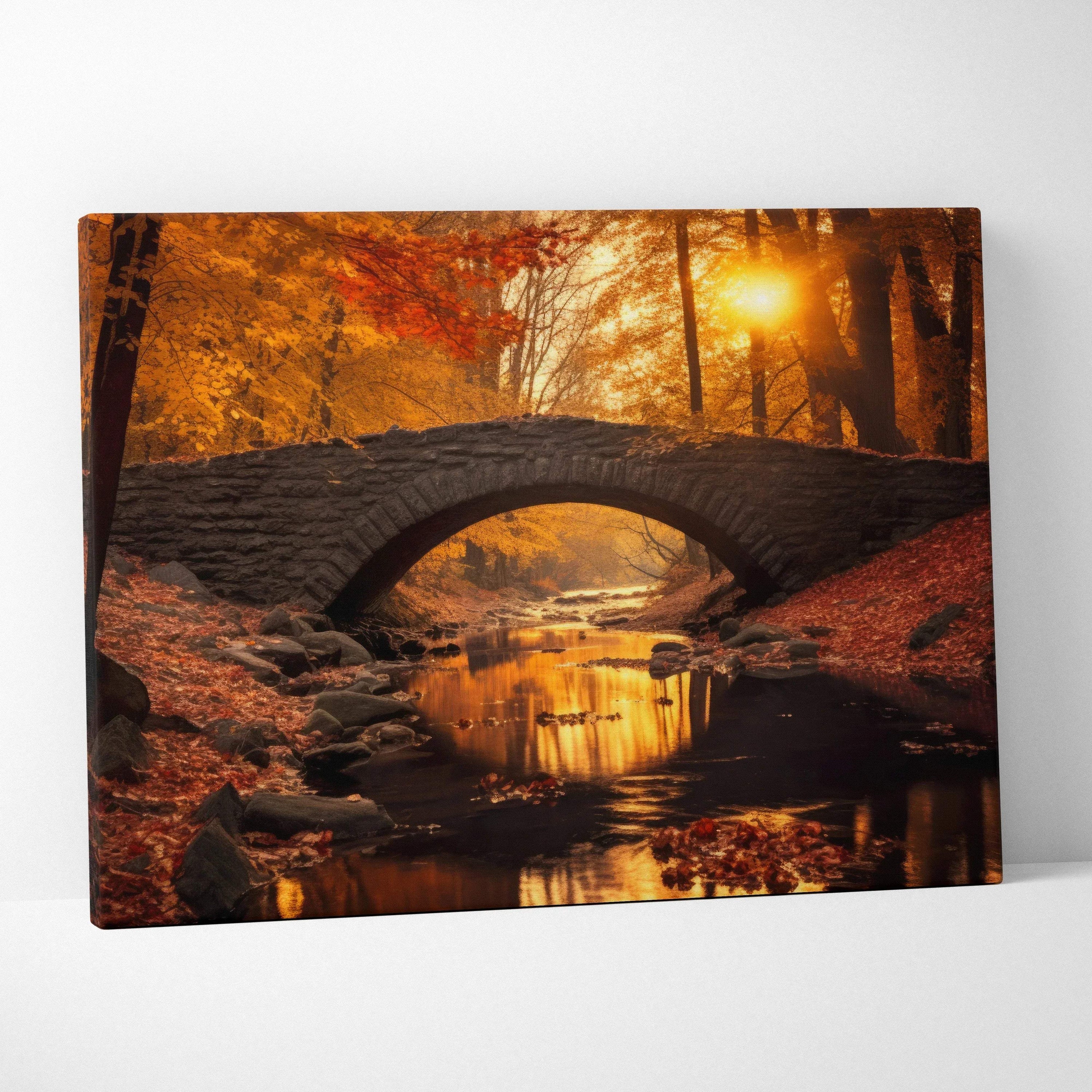 Autumn foliage canvas wall art with vibrant red, orange, and gold leaves and a stone bridge over a stream at sunset.
