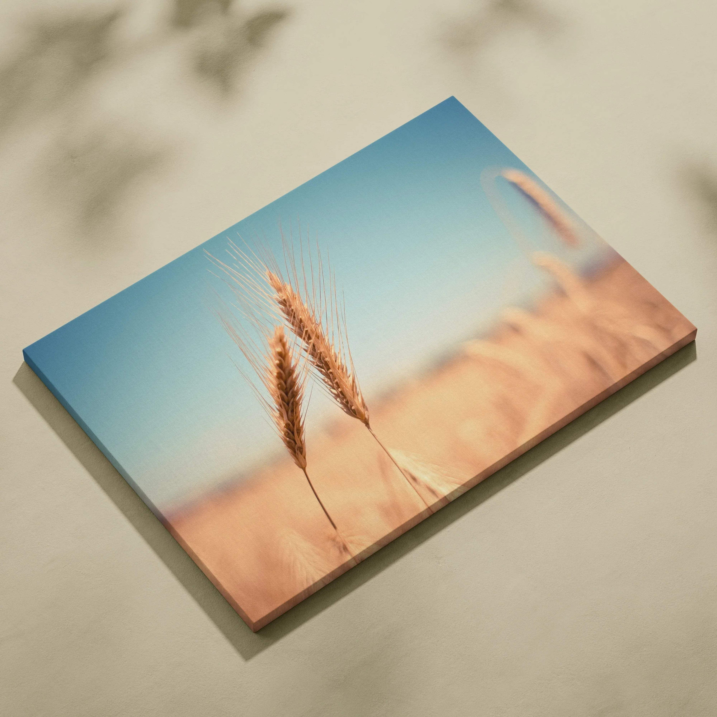 Floral wheat field close-up on high-resolution canvas wall art with soft blue sky background.
