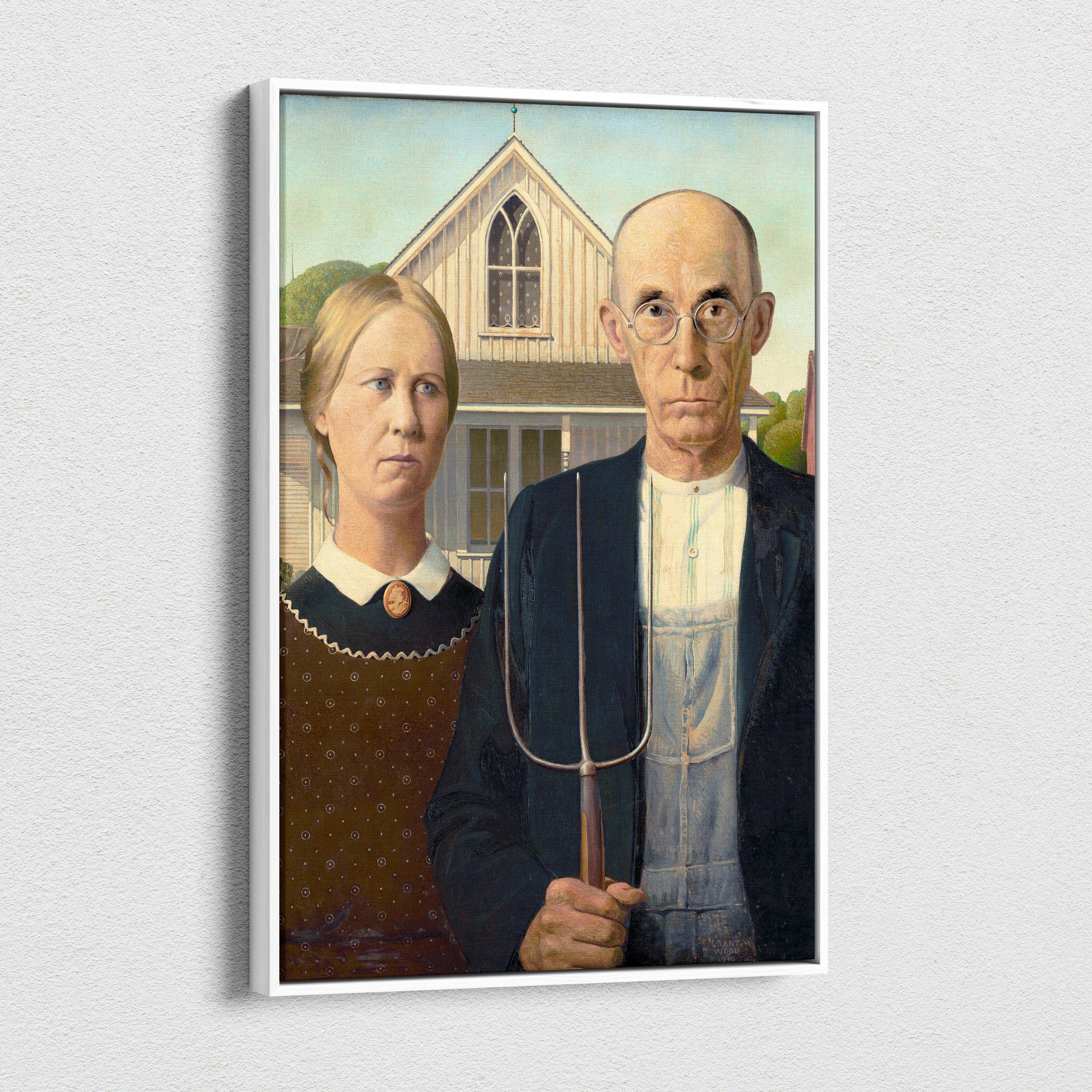 White-framed canvas print of Grant Woods American Gothic